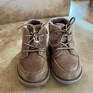 Brown kids’ UGG boots, size 7T